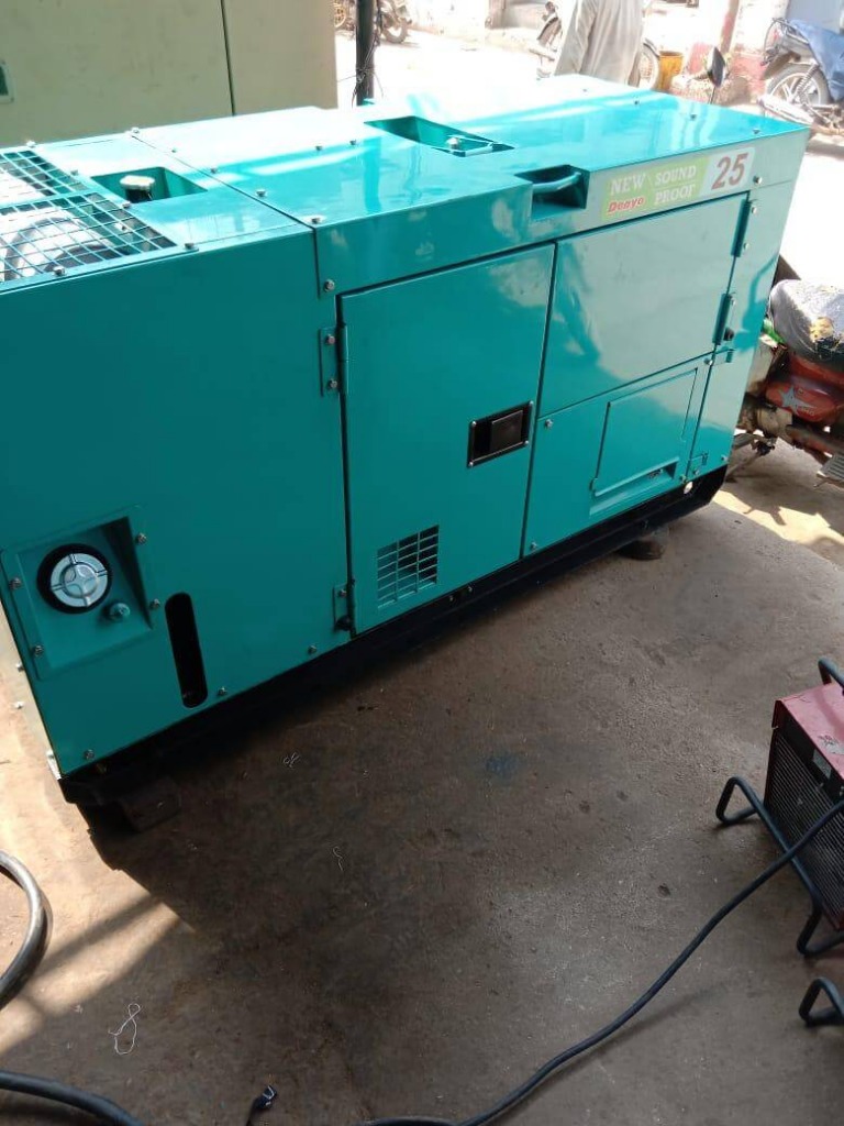 Teal Denyo 25 KVA generator in bright daylight